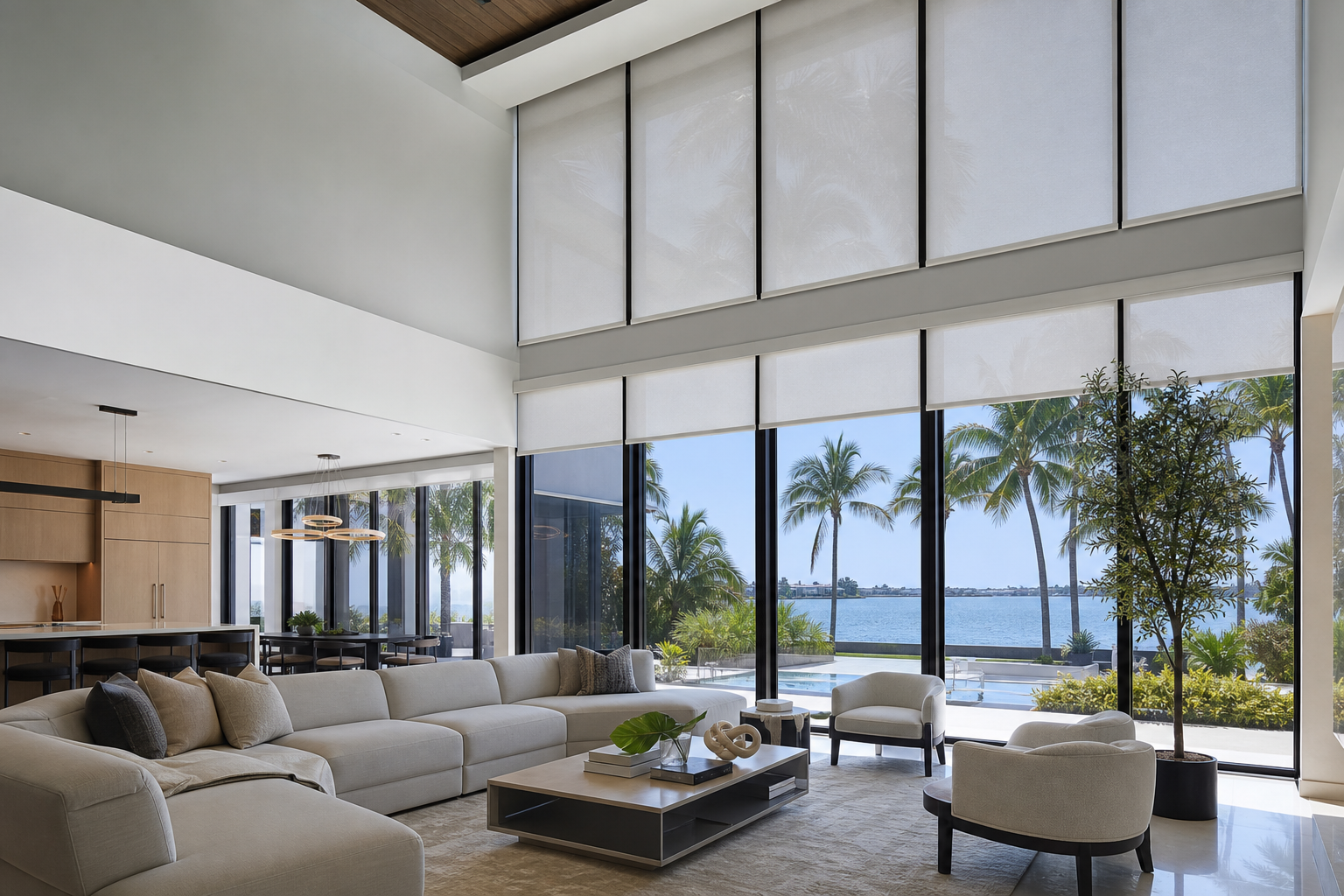 Modern South Florida living room with tall windows and custom motorized shades beneath a high ceiling